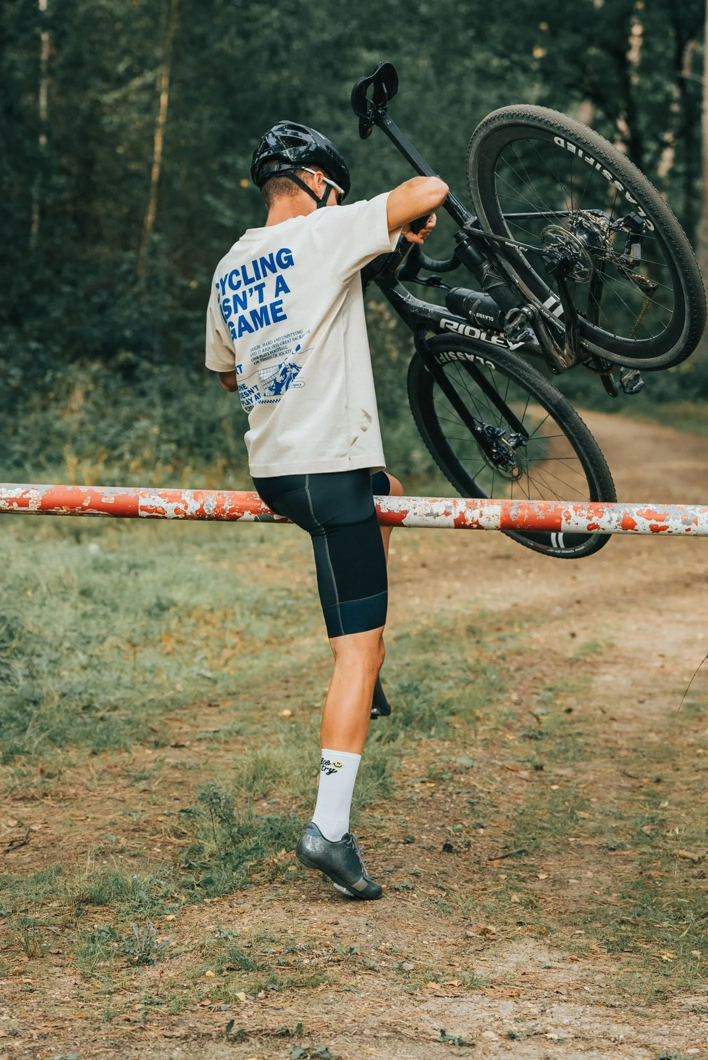 Cycling isn't a game oversized unisex cycling T-shirt (natural - electric blue)